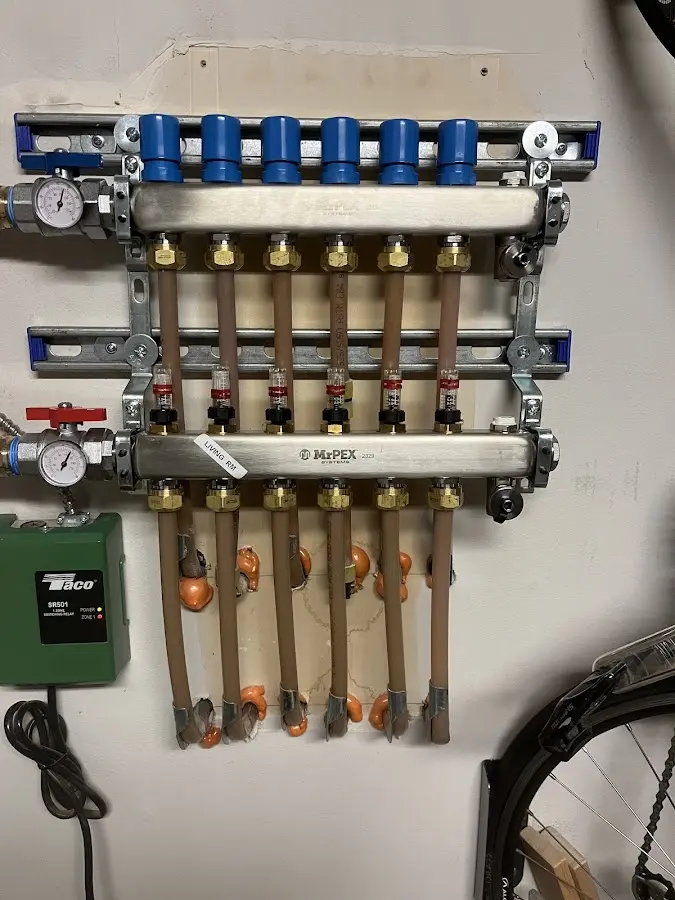 Plumber performing Water Heater Repair at a residential property in Batesville